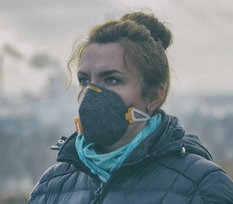Woman wearing a pollution mask